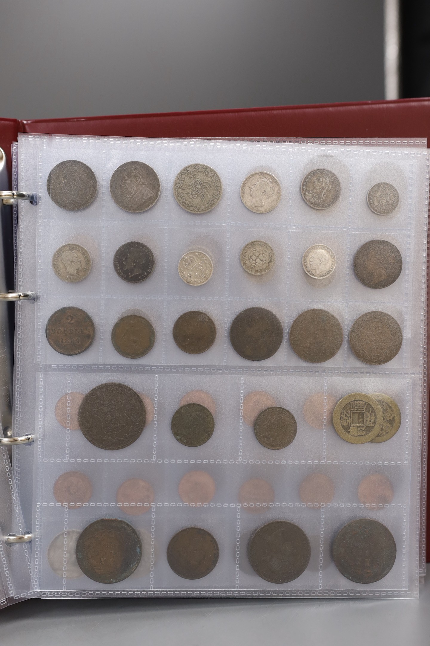 An album of British, Commonwealth and world coins including